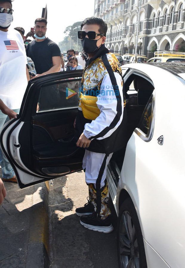 karan johar spotted at gateway of india, leaving for varun dhawan-natasha dalal’s wedding