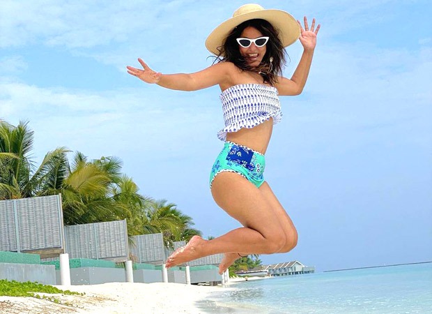 Hina Khan looks ecstatic as she poses in bikini bottoms and a crop top by the beach