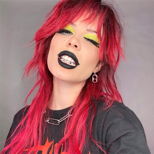 Pregnant Halsey gives modern twist to goth style with dramatic makeup and red wig