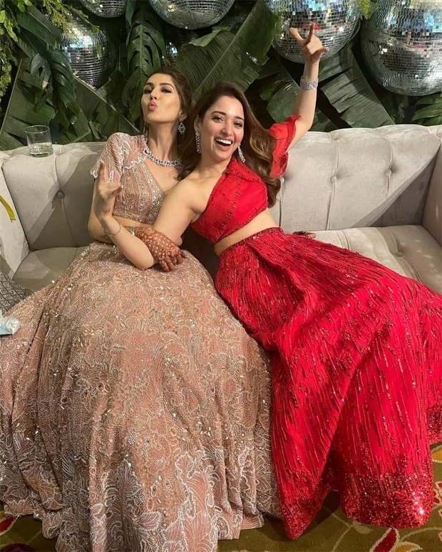 tamannaah bhatia makes us swoon in red and blue lehengas at her friend’s wedding