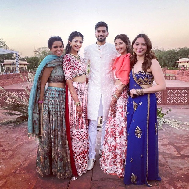 tamannaah bhatia makes us swoon in red and blue lehengas at her friend’s wedding