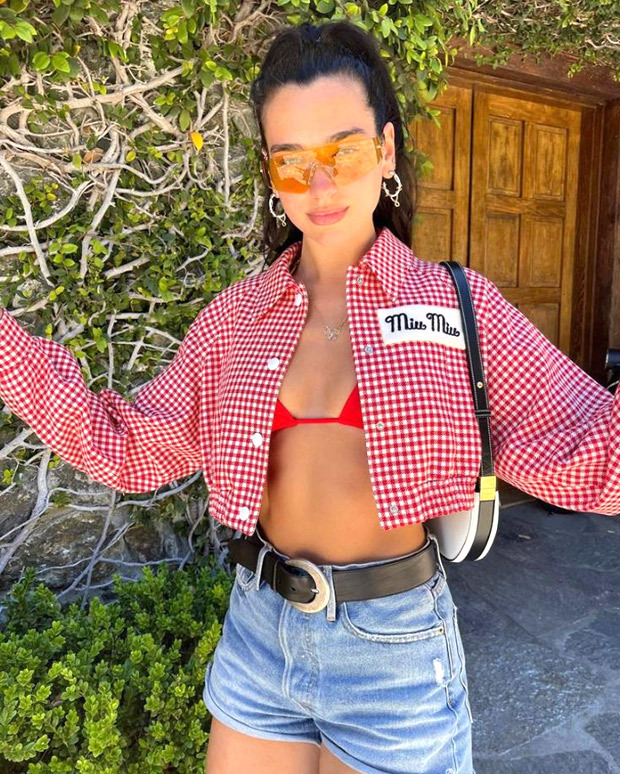 dua lipa enjoys her cowboy moment in red bikini top, checkered miu miu shirt, denim shorts and burberry bag