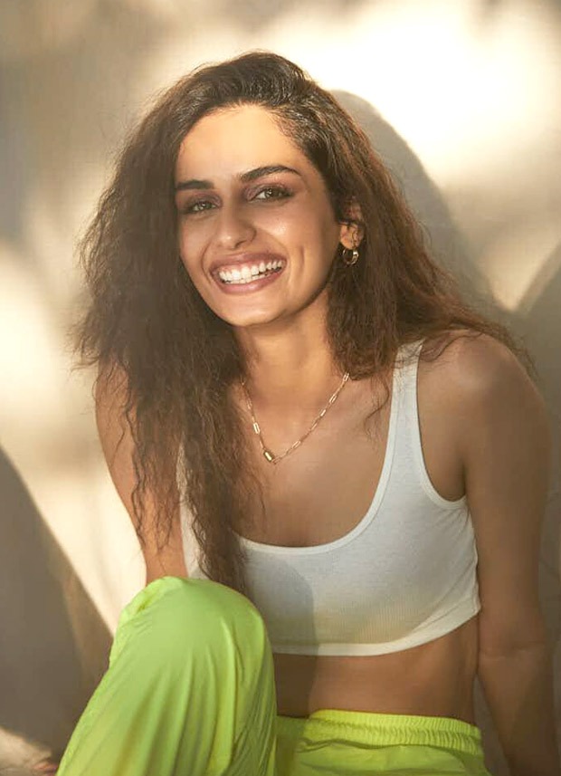 manushi chhillar opts for white crop top and neon sweatpants to brighten up her summer look