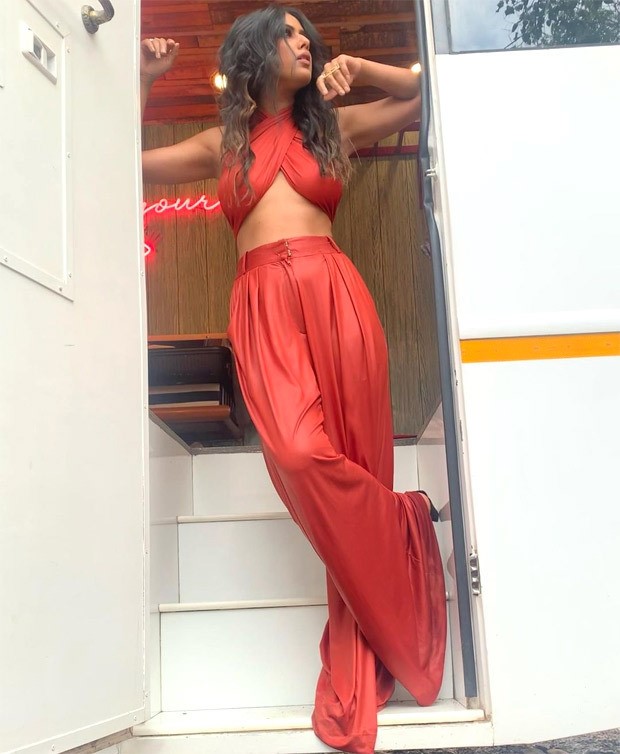nia sharma dons risky criss-cross tie-up top and high waist pants in these sultry pictures