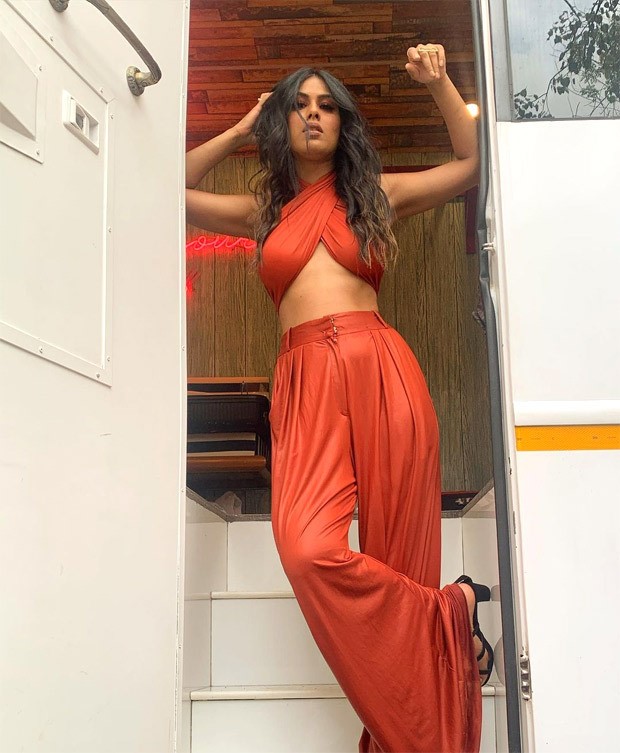 nia sharma dons risky criss-cross tie-up top and high waist pants in these sultry pictures