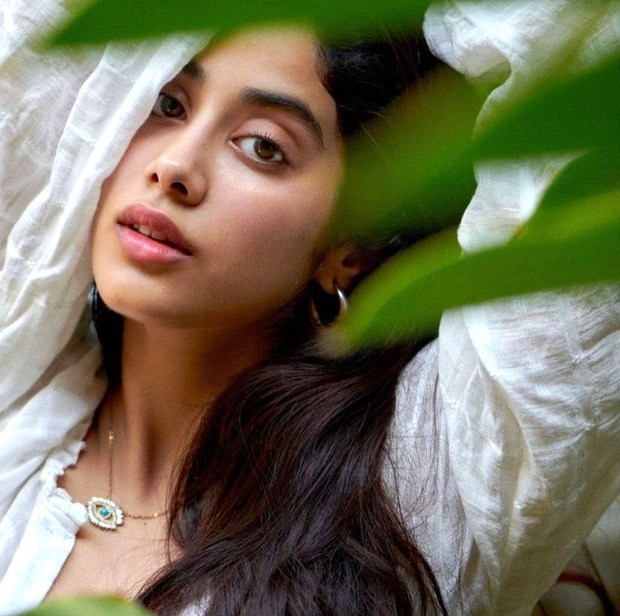 janhvi kapoor gives a smouldering look dressed in white shirt