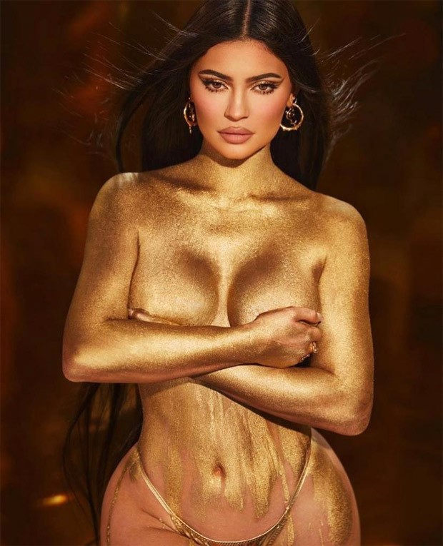 Kylie Jenners goes topless with shimmery body paint to promote her birthday make up collection