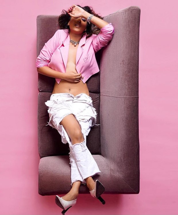 Nia Sharma dons risky cropped plunging neckline pink blazer and white denims