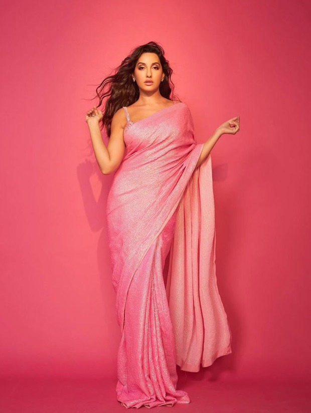 Nora Fatehi in a pink sequin saree paired with bright studded bralette is jaw-dropping