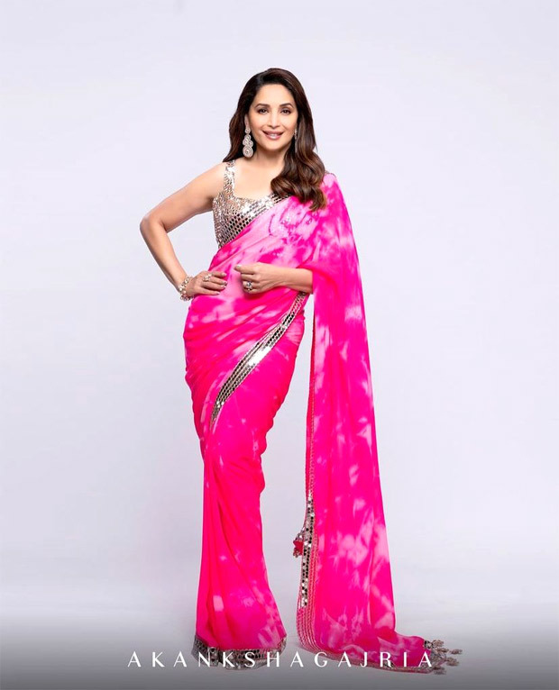 madhuri dixit is an absolute beauty in a bright pink tie dye saree with mirror work details