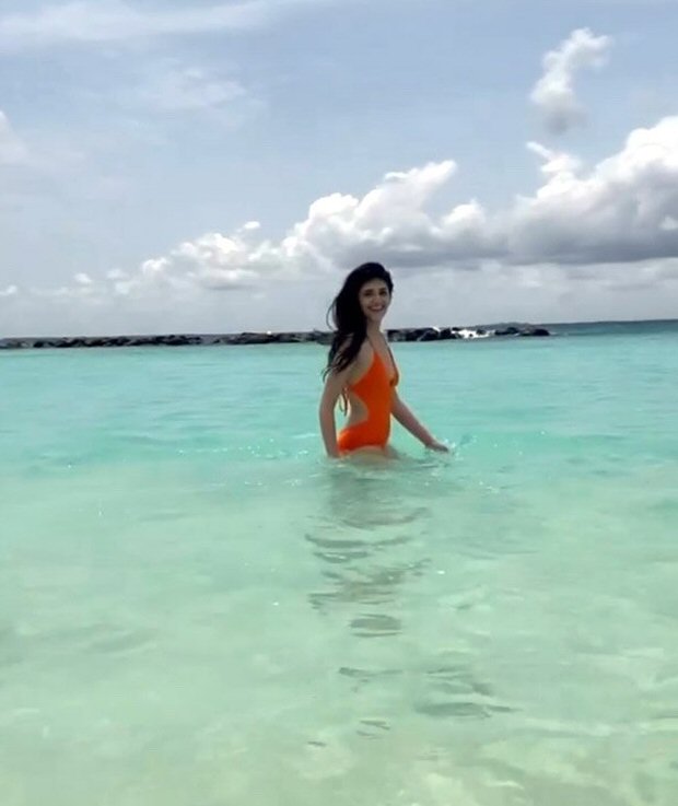 sanjana sanghi makes a splash in orange swimsuit while holidaying in maldives