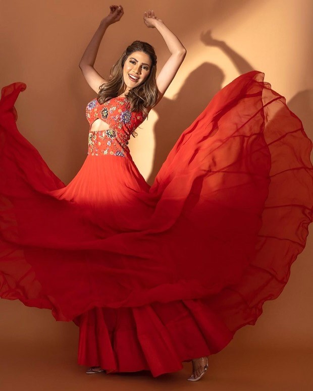 nikki tamboli looks breathtaking in a gorgeous red gown