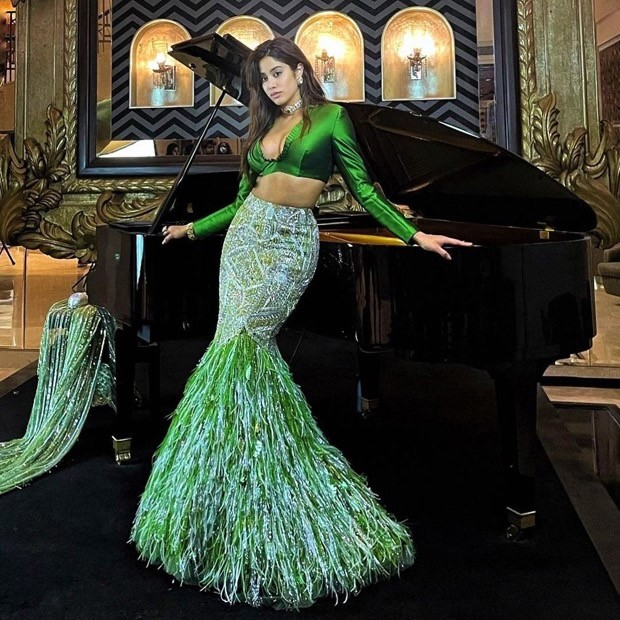 janhvi kapoor is all about grace and charm in alluring mermaid style feathered manish malhotra green lehenga