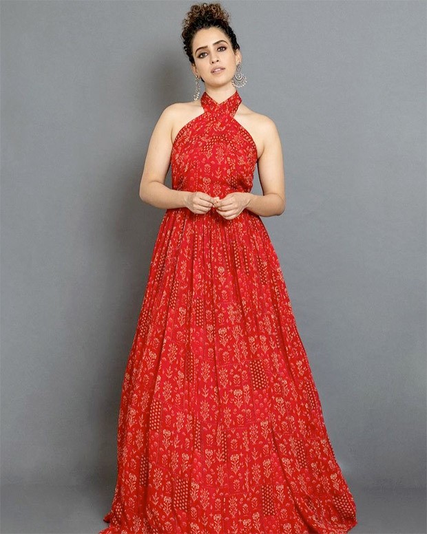 sanya malhotra glows in a beautiful red halter neck dress worth rs. 16,500