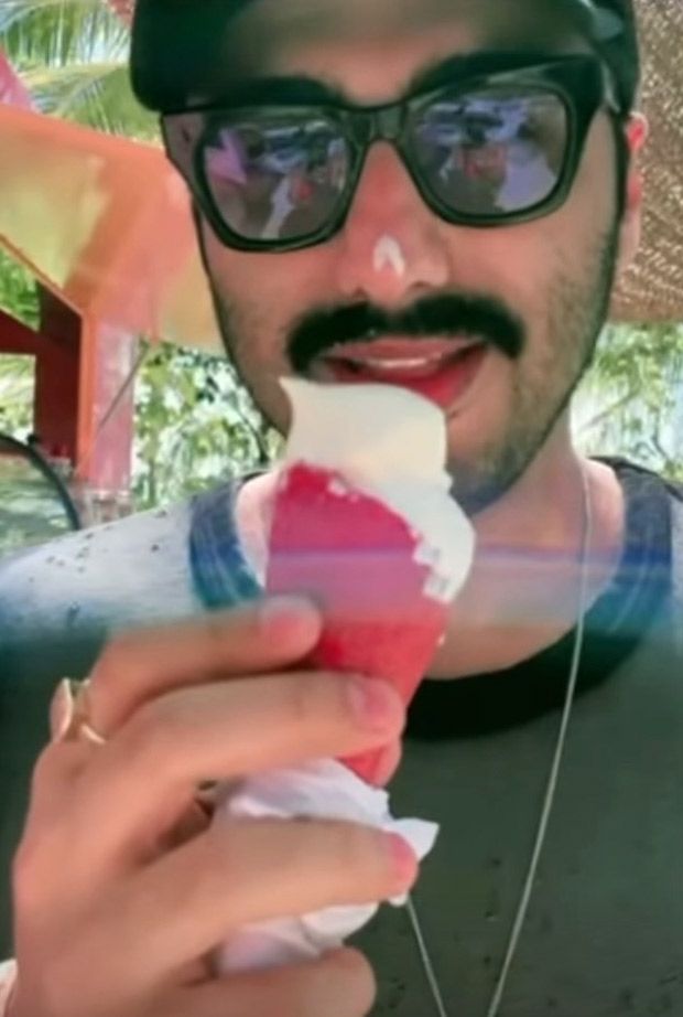 arjun kapoor enjoys ice cream in a video from the maldives, malaika arora cutely wipes it off his nose. watch