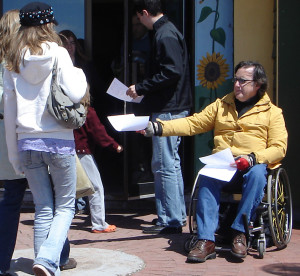 Why is CBC fighting against a free press in Canada photo Stephen Pate handing out Disability Fast Facts at Charlottetown Farmer’s Market 2007